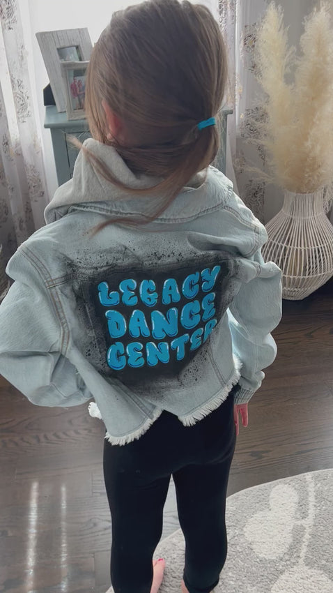 Legacy Dance Center custom hand painted denim jacket for children, girls.  Blue denim.  Black spray paint.  Hand painted graffiti.  Best seller.