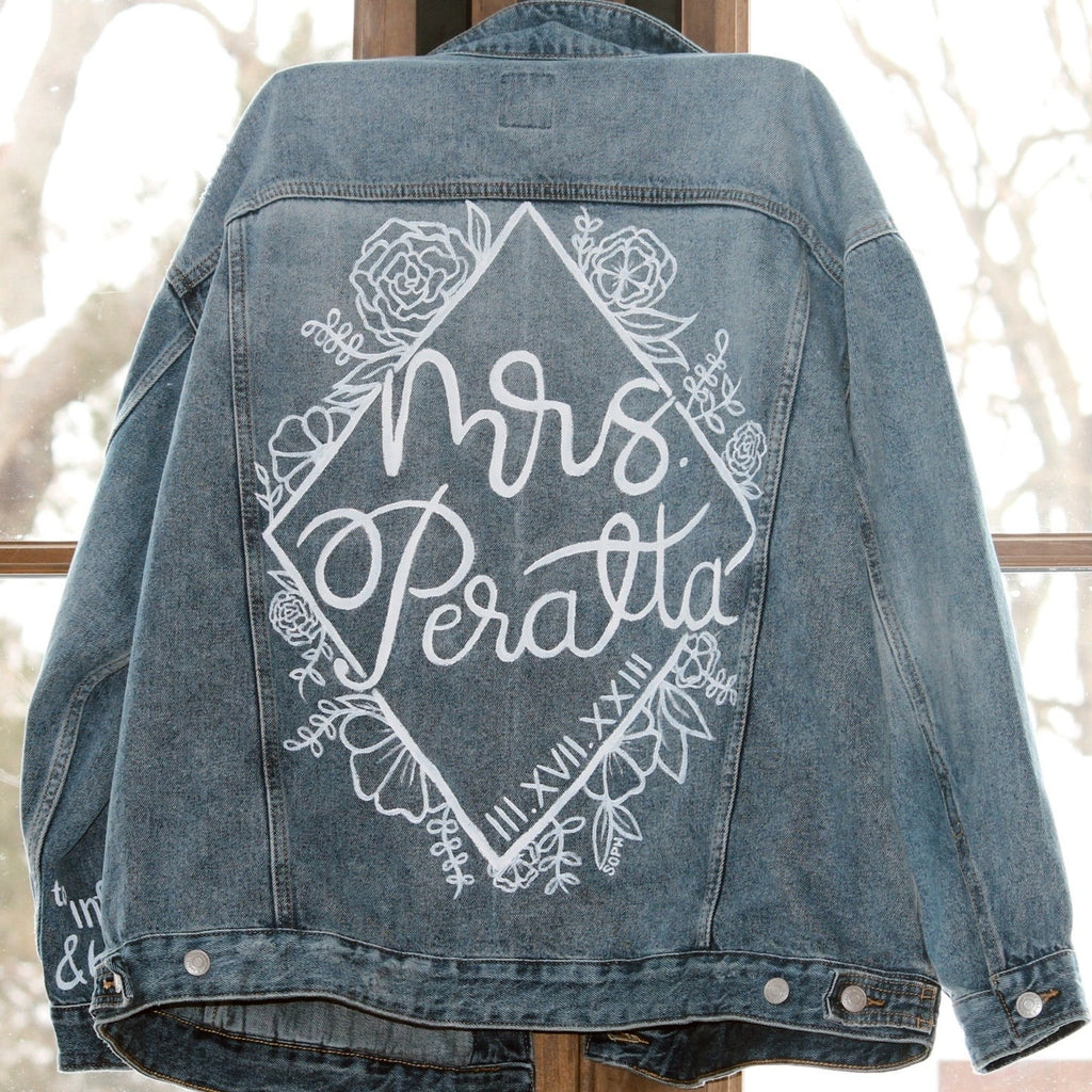 Custom Bridal Wedding Denim Jacket - Hand-Painted, Flowers, Personalized Initials, Love Quote - Unique Chic Fashion for Memorable Wedding Day. #BridalStyle #WeddingFashion